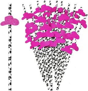 Close-up detail of cow print paper drinking straws featuring sparkly pink cowboy hat decor.