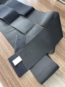 Black elastic waist wrap detail view, adjustable fitness abdominal binder for yoga and workout.
