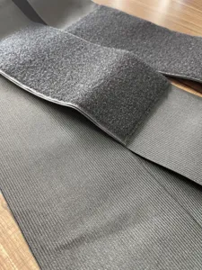 Grey elastic bandage waist wrap detail, breathable knit fabric with secure hook and loop fastener.