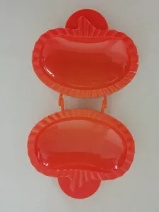 Red plastic hand pie mold set for baking delicious fruit and pumpkin pastries easily.