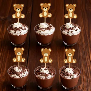 Cute bear cake topper picks with chocolate mousse cups, perfect for animal party dessert decor.