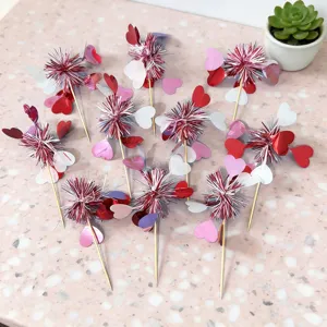 Detailed closeup view of sparkling red and white heart cake toppers, perfect for Valentine party decor.