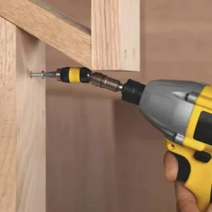 Close-up shot showing the magnetic flexible drill bit extension in action for woodworking tasks.