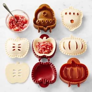 Detailed view of autumn hand pie molds set featuring acorn, pumpkin and apple designs.