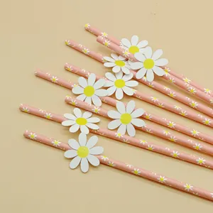 Detail view of pink paper drinking straws with cute daisy flower cards for party decor.