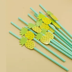 Eco-friendly biodegradable paper straws with tropical pineapple decorations for drinks.