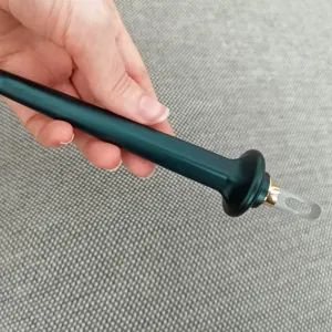 Silicone eyeliner brush detail view, precise makeup tool handle close-up shot for fine lines.
