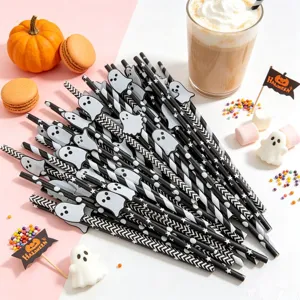 Halloween paper straws with ghost decor, black white striped party supplies dessert table.