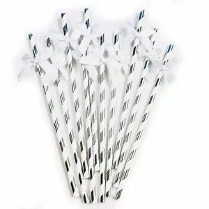 Silver striped paper straws with bows detail shot for party decor and dessert tables.