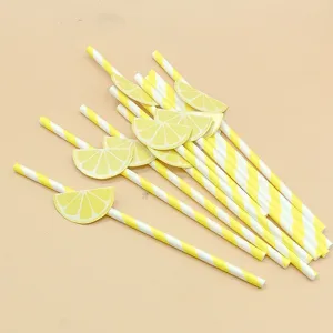 Disposable biodegradable paper straws with cute lemon slice decorations for parties and drinks.