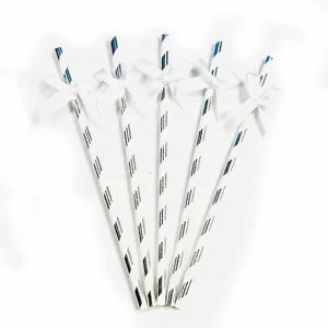 Decorative paper straws with white ribbon bows, perfect for party, birthday and dessert tables.