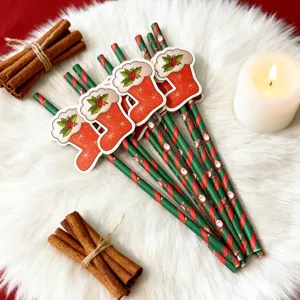 Christmas decorative paper straws with cute stocking charms for holiday party decor items.