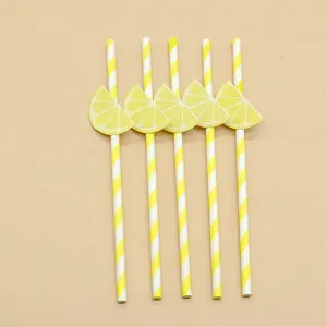 Biodegradable paper straws featuring cute yellow lemon decorations for parties and baking.