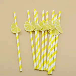 Disposable paper straws with yellow stripes and lemon slice decorations for parties and drinks.