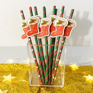 Christmas decorative paper straws detail view, festive party supplies with cute stocking toppers.