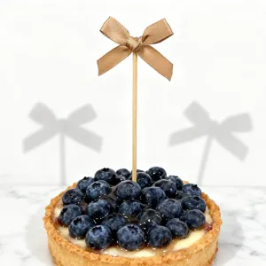 Gold bow cake topper for birthday party dessert baking decoration and cupcake picks.