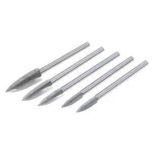 Close-up of HSS 3-flute pointed engraving milling cutters, sharp metal woodworking tool bits.