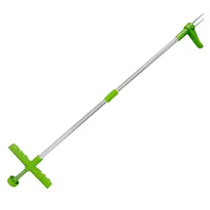 Detail view of the standing weed puller tool, showing the metal pole and durable claw mechanism.