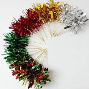 Colorful metallic tinsel cake topper detail view, decorative party cocktail picks and food decor.