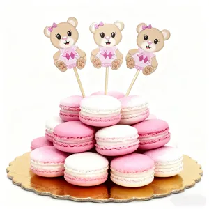Cute bear cake toppers with pink and white macarons for birthday party dessert decoration
