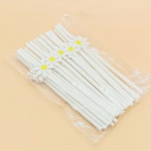 White paper drinking straws with cute daisy flower decorations, perfect for party supplies.
