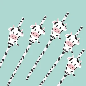 Detail view of cute cow paper straws featuring adorable animal designs for party decoration.