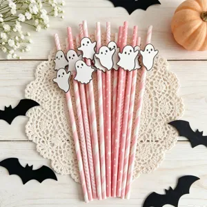 Halloween pink paper straws with cute ghost cutouts, perfect for party dessert table decor.