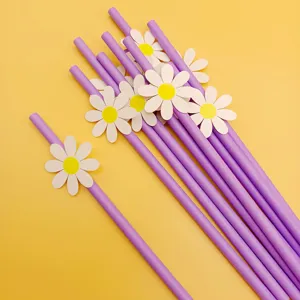 Purple paper straws with white daisy flower decorations, creative party supplies for drinks.