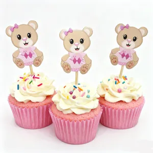 Cute bear cupcake toppers detail shot featuring pink dresses and decorative sprinkles.
