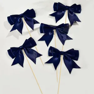 Dark blue satin bow cake toppers with wooden sticks for party baking dessert decorations.