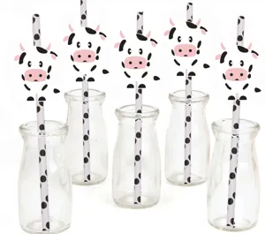 Cute cow paper straws set with glass bottles for birthday party table decoration supplies.