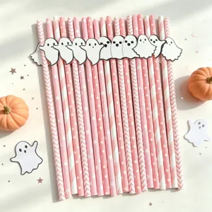 Pink Halloween paper straws with cute ghost cutouts, perfect for party dessert table decor.