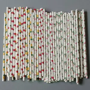 Close-up details of tropical paper straw patterns with cute flamingo and pineapple prints
