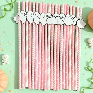 Close-up of cute Halloween paper straws with ghost insert for dessert table party decor.