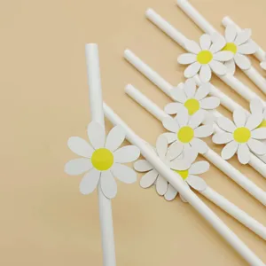 Close up of white paper drinking straws decorated with cute little daisy flowers for party decor.
