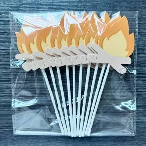 Close-up detail of campfire cake toppers set, arranged neatly in transparent packaging bag.