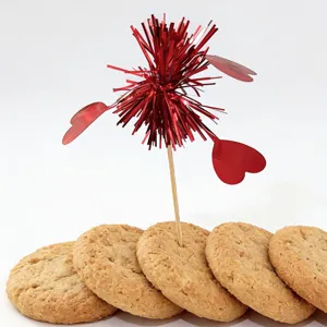 Valentine day cake topper with red heart tinsel and delicious round cookies for party decor