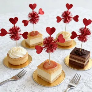 Detailed close-up of decorative red heart cake picks inserted in delicious desserts, perfect for parties.