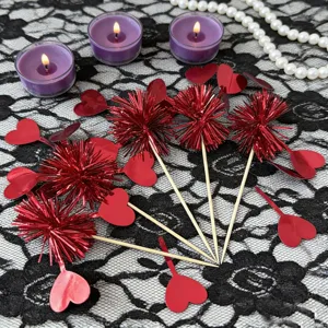 Red heart tinsel cake toppers and decorative cocktail picks for Valentine party desserts.