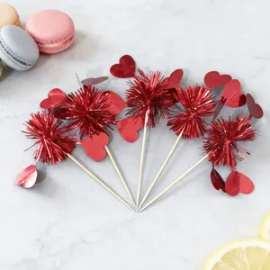 Detail view of creative red heart firework picks, perfect for cake and dessert decoration.
