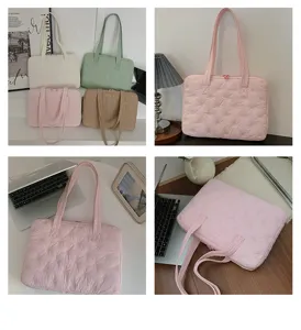 Vue détaillée du sac cabas matelassé avec nœud pour ordinateur portable de 14 pouces.