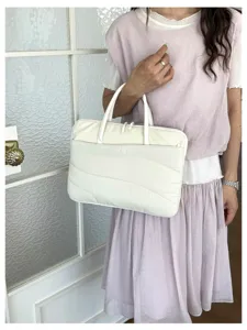 Detailed view of the Korean quilted laptop sleeve, showcasing soft fabric and delicate waves.