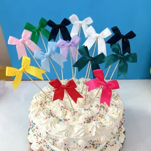 Colorful satin bow cake toppers with wooden sticks, perfect for dessert party decoration.