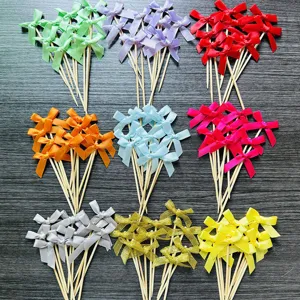 Colorful satin bowknot cake toppers and dessert picks for baking and party decorations.
