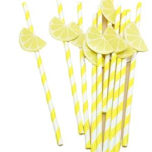 Disposable biodegradable paper straws with yellow lemon slice decorations for party drinks.