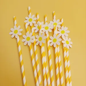 Yellow striped paper straws with white daisy decorations, perfect for party and event decor.