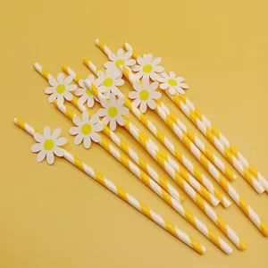 Yellow striped paper straws decorated with cute white daisies for party table decor.