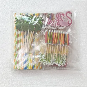 Close-up details of Hawaiian party paper straws and tropical cocktail umbrella picks.