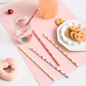 Biodegradable paper straws with cute fruit patterns, eco-friendly party drink accessories.