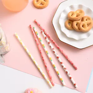 Disposable paper drinking straws with cute fruit patterns for party decoration and drinks.